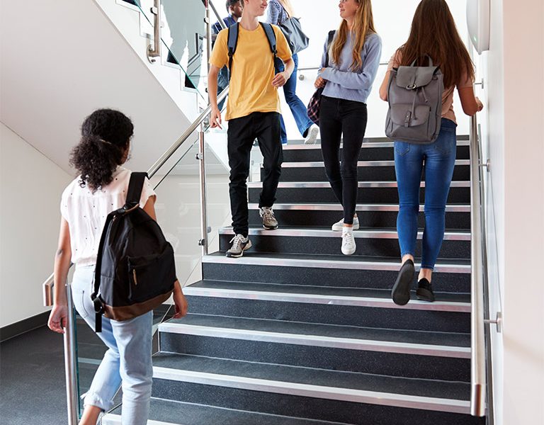 01-high-school-students-walking-on-stairs-between-SQE892G.jpg
